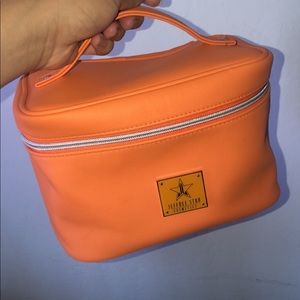 Orange Jeffree Starr makeup bag
